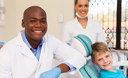 dental assistant with a child patient