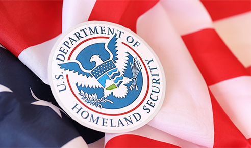 homeland security badge laying on american flag