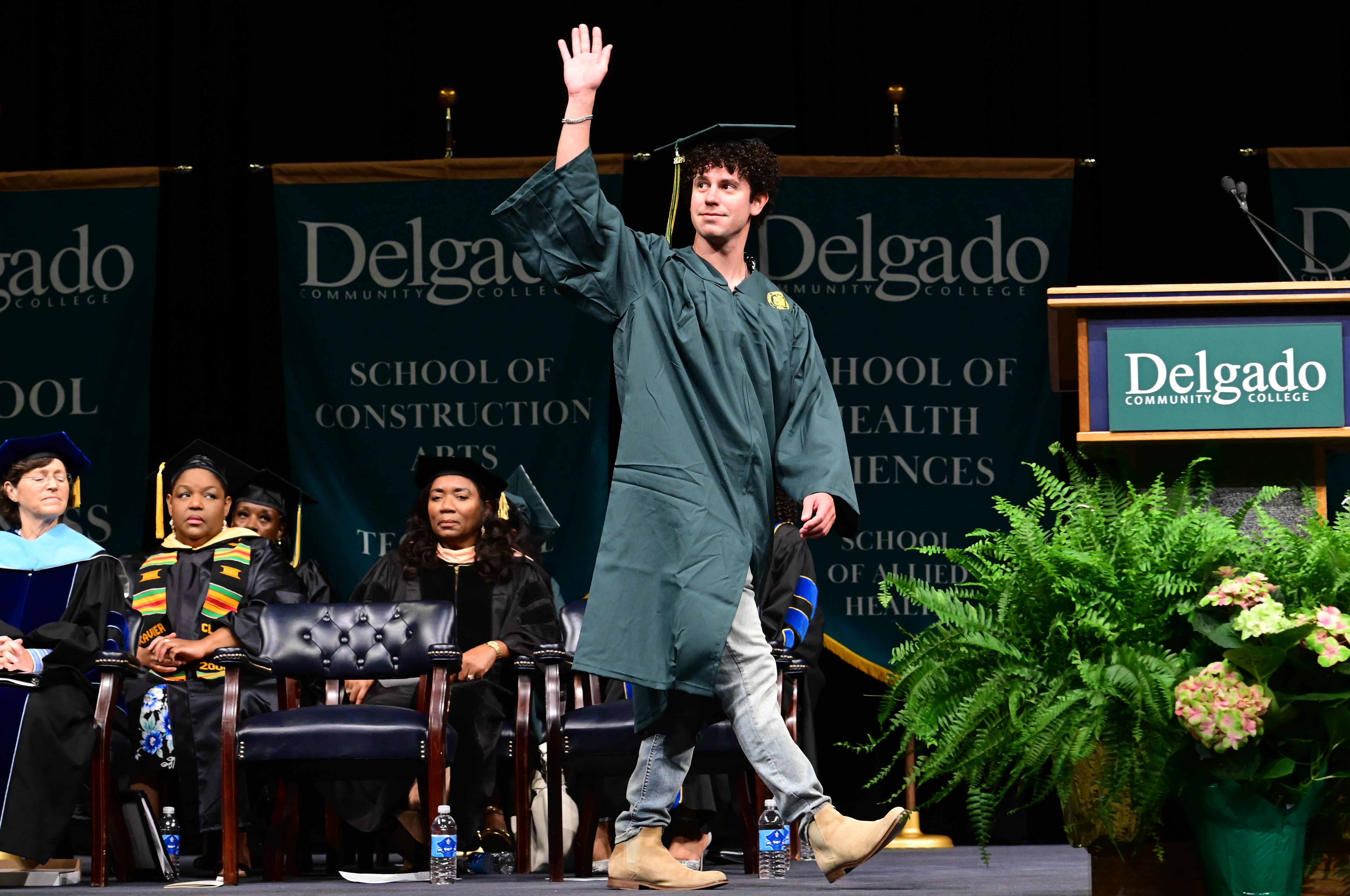 Graduate walking across the stage
