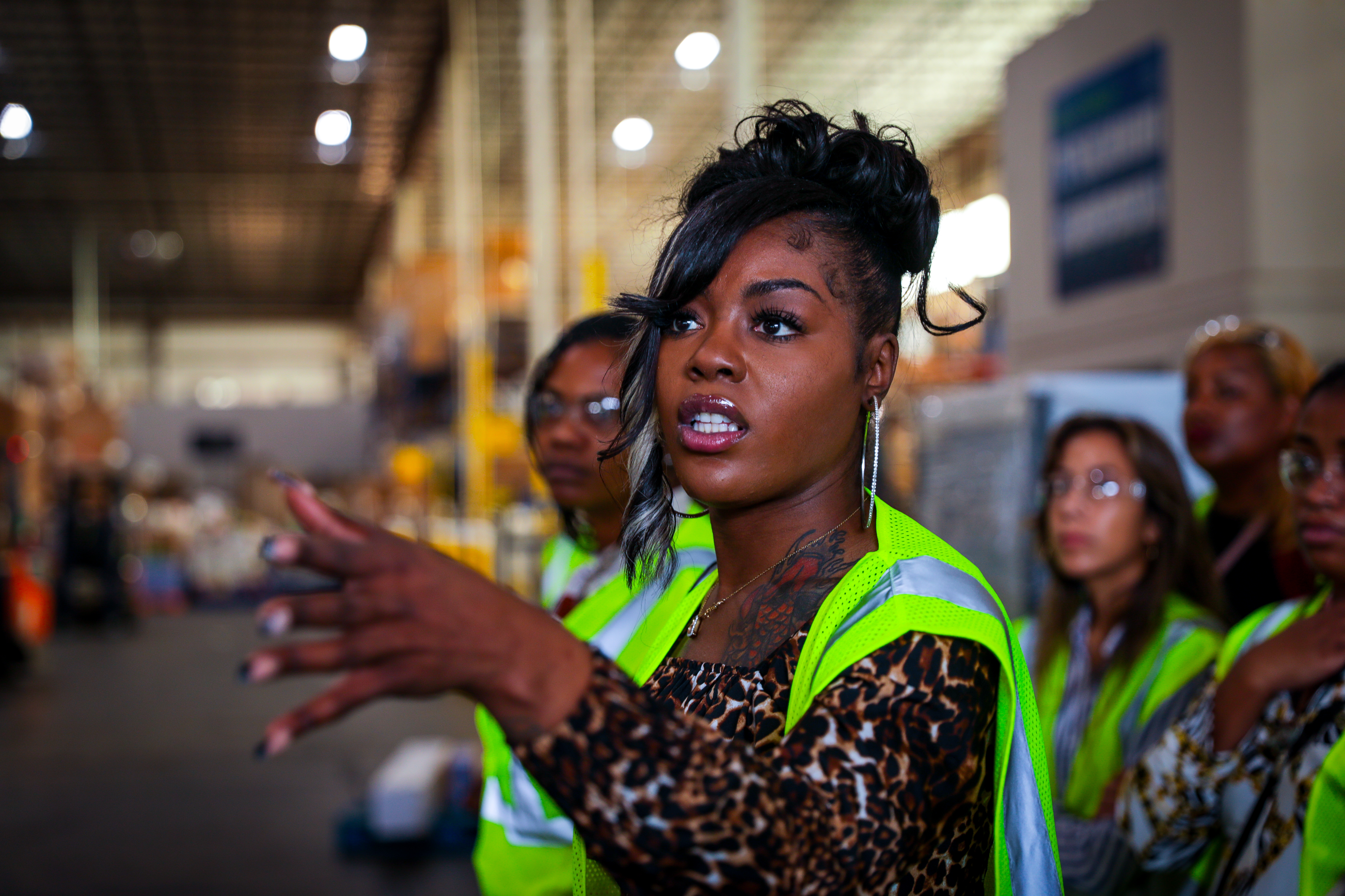 Female student interacting with tour guide at PepsiCo facility