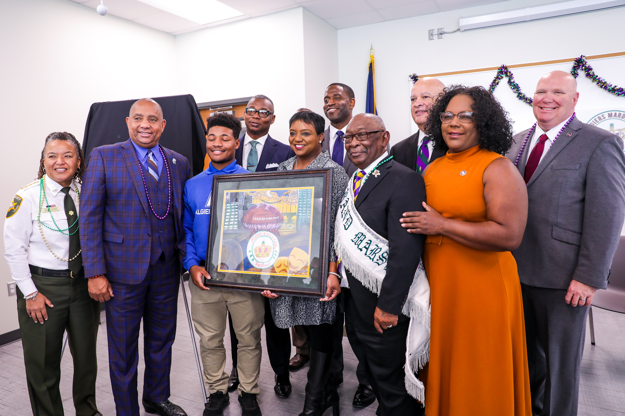 Gruop photo of participants in the Algiers Mardi Gras Festival press conference