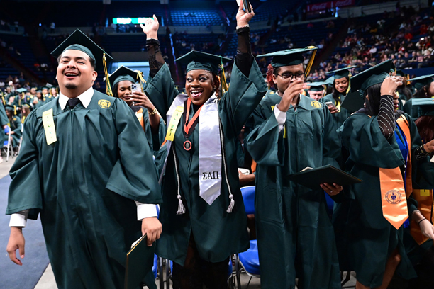 students rejoicing at graduation