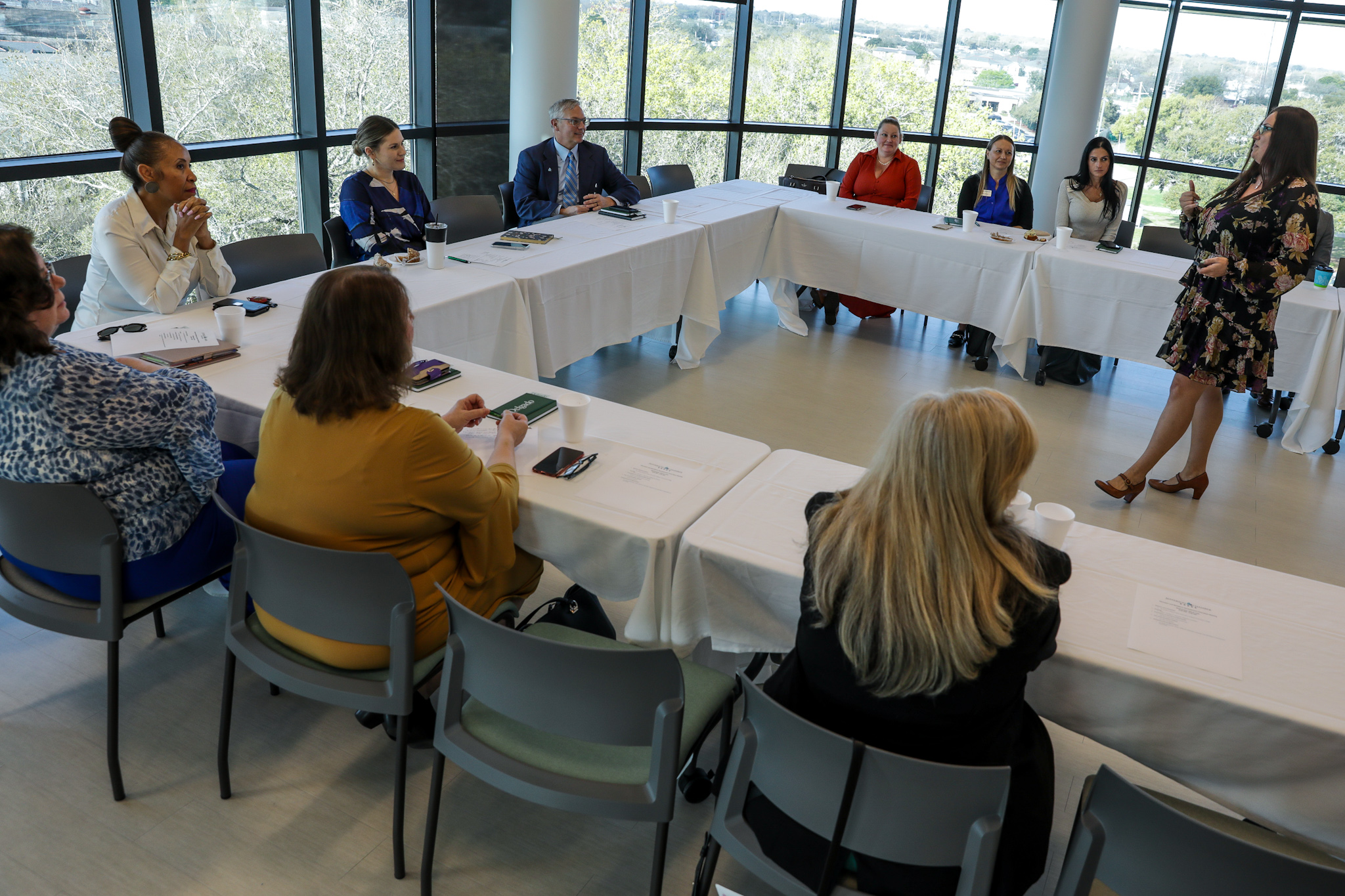 Dean Fernandez speaks while members of the Jefferson Chamber and Chancellor Steib listen