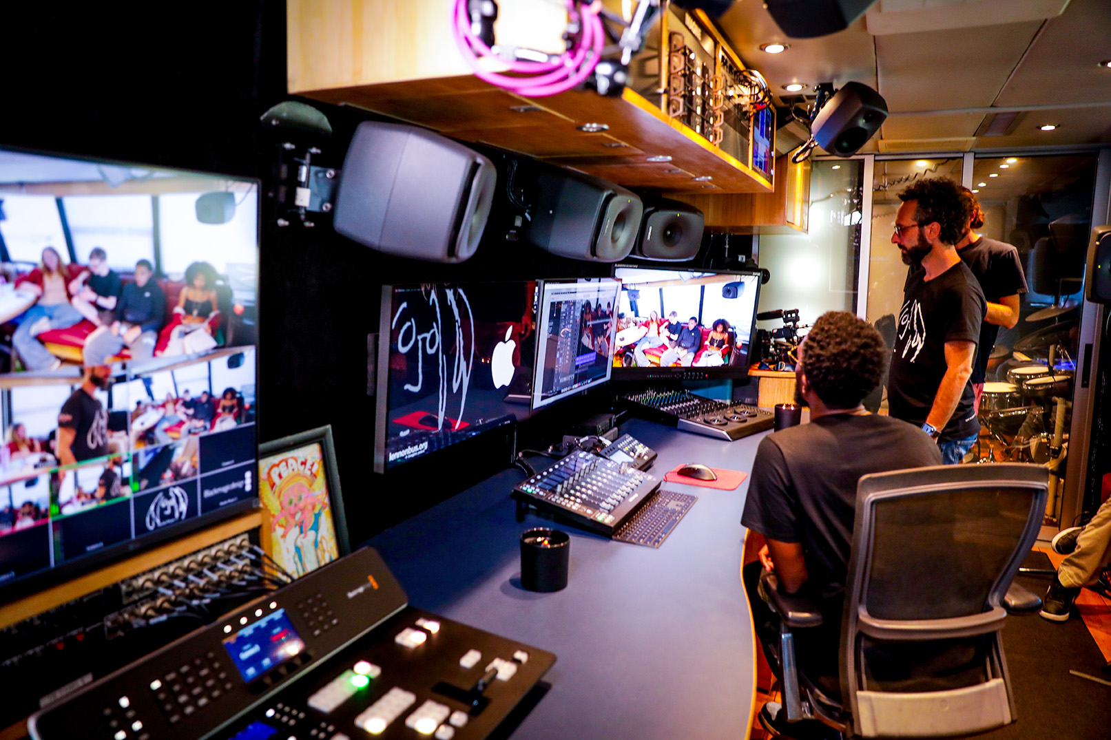 The John Lennon tour bus team edits video of the students