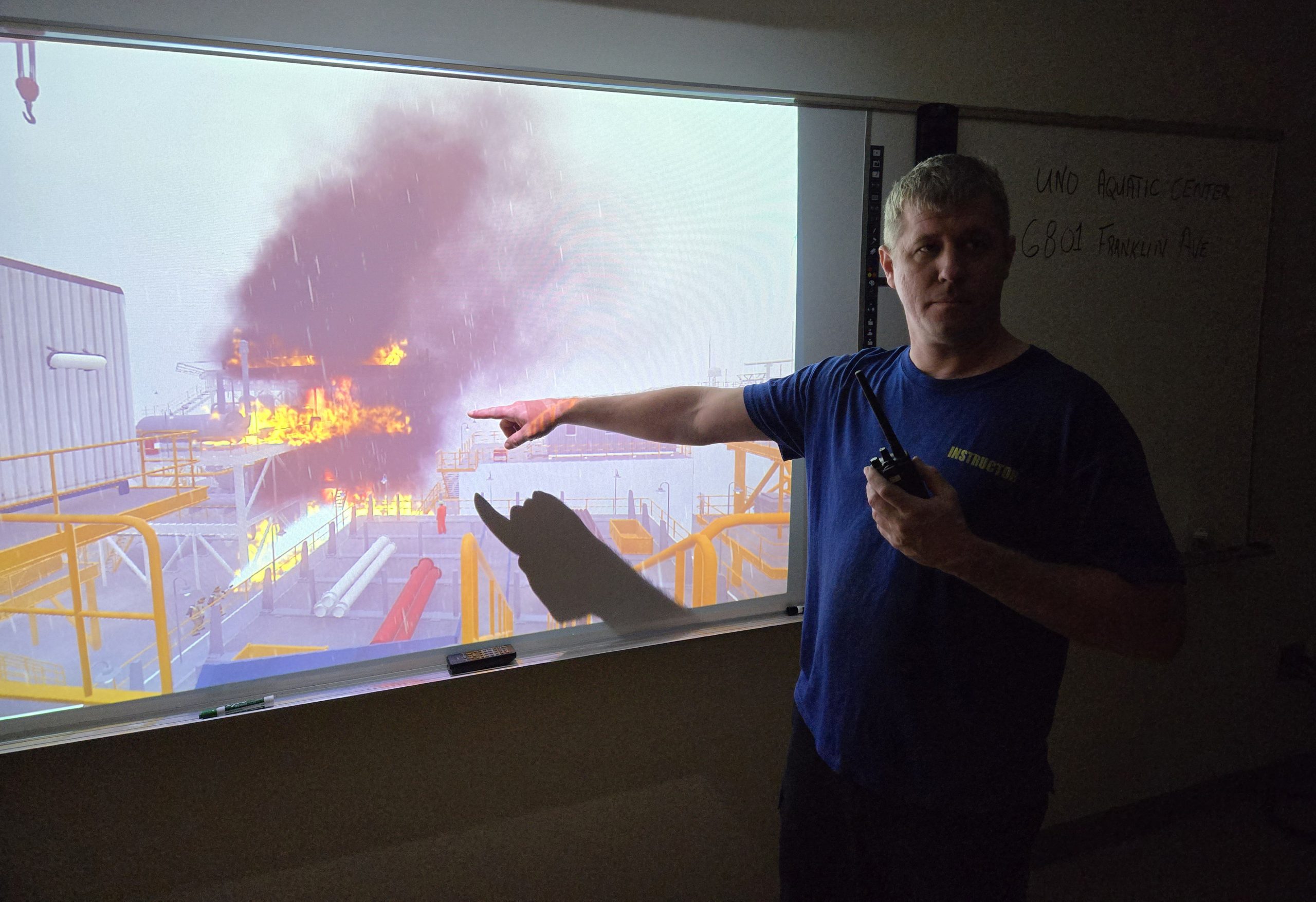 An instructor points out details about a fire