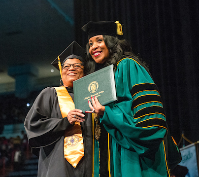 Chancellor Steib with graduating student