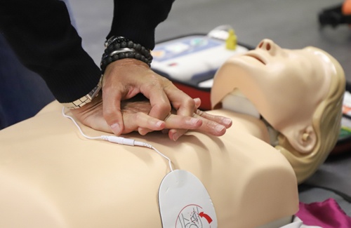 student performing CPR on a dummy